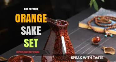 Elegant Art Pottery Orange Sake Set: A Japanese Tradition