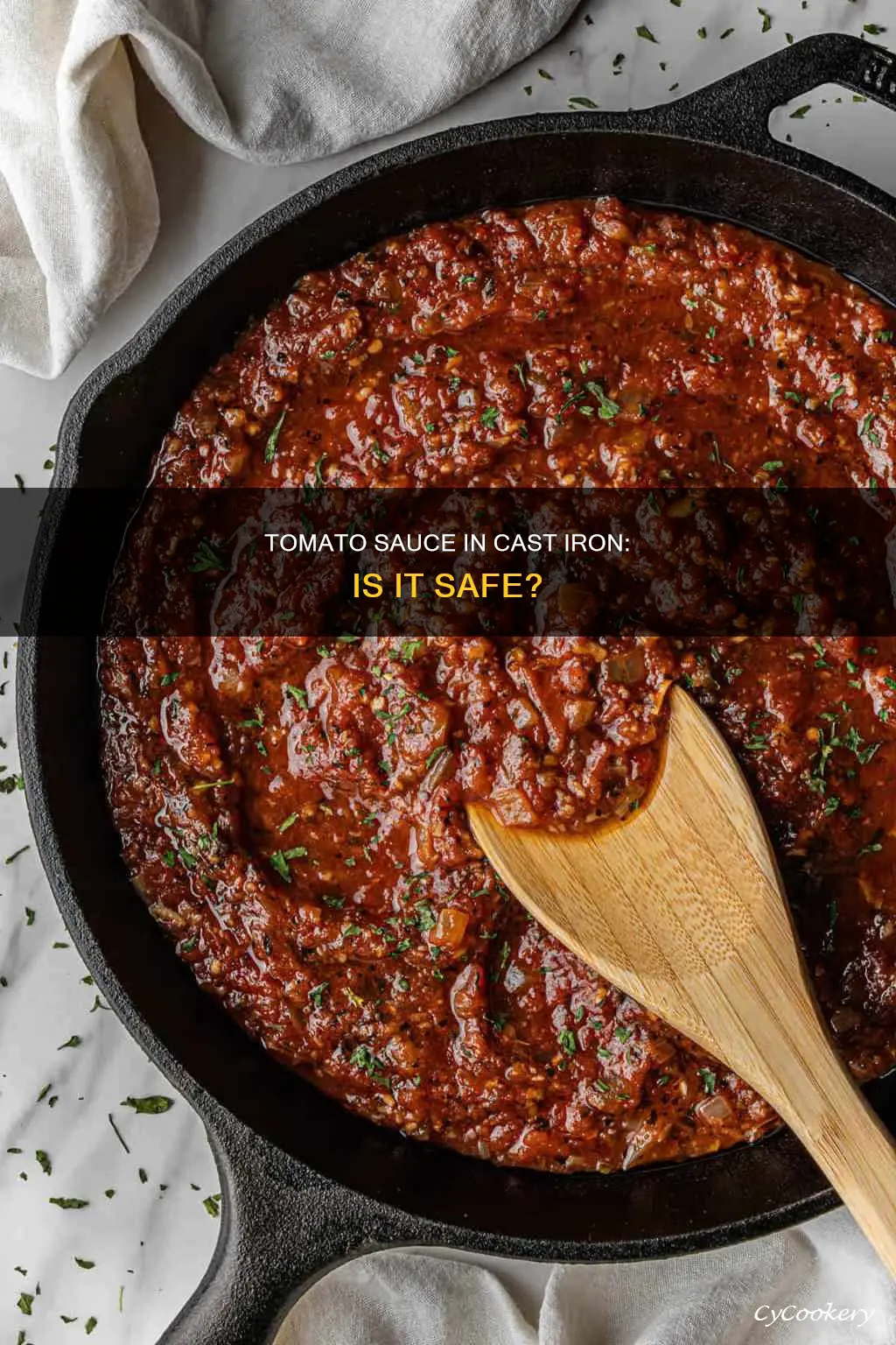 can you put tomato sauce in a cast iron pan