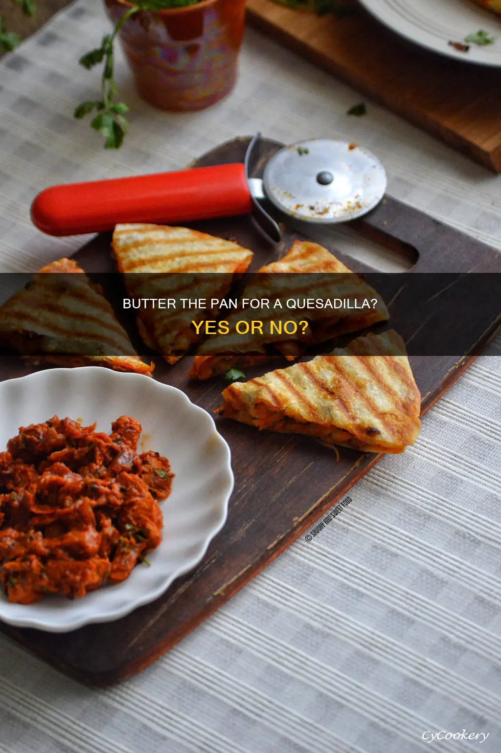 do you butter the pan for a quesadilla