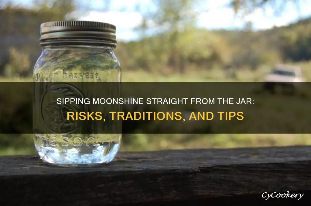 drinking moonshine from jar