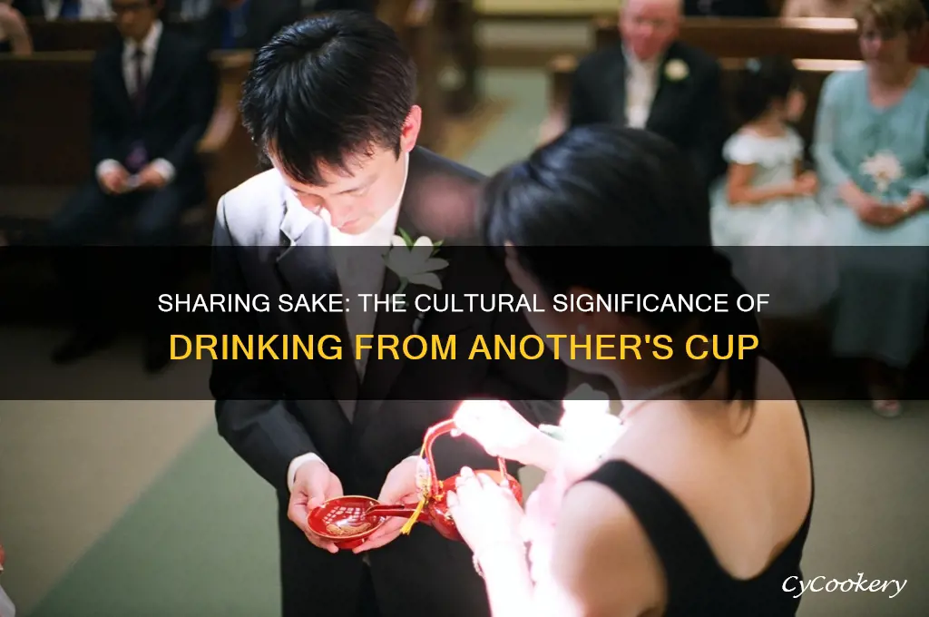 drinking sake from another