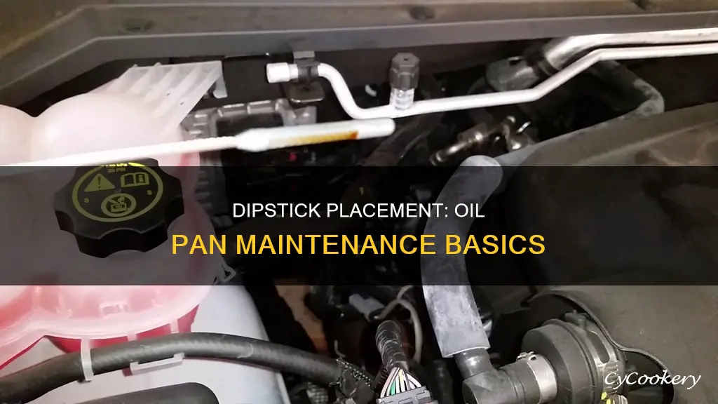 how far does the dipstick go in the oil pan