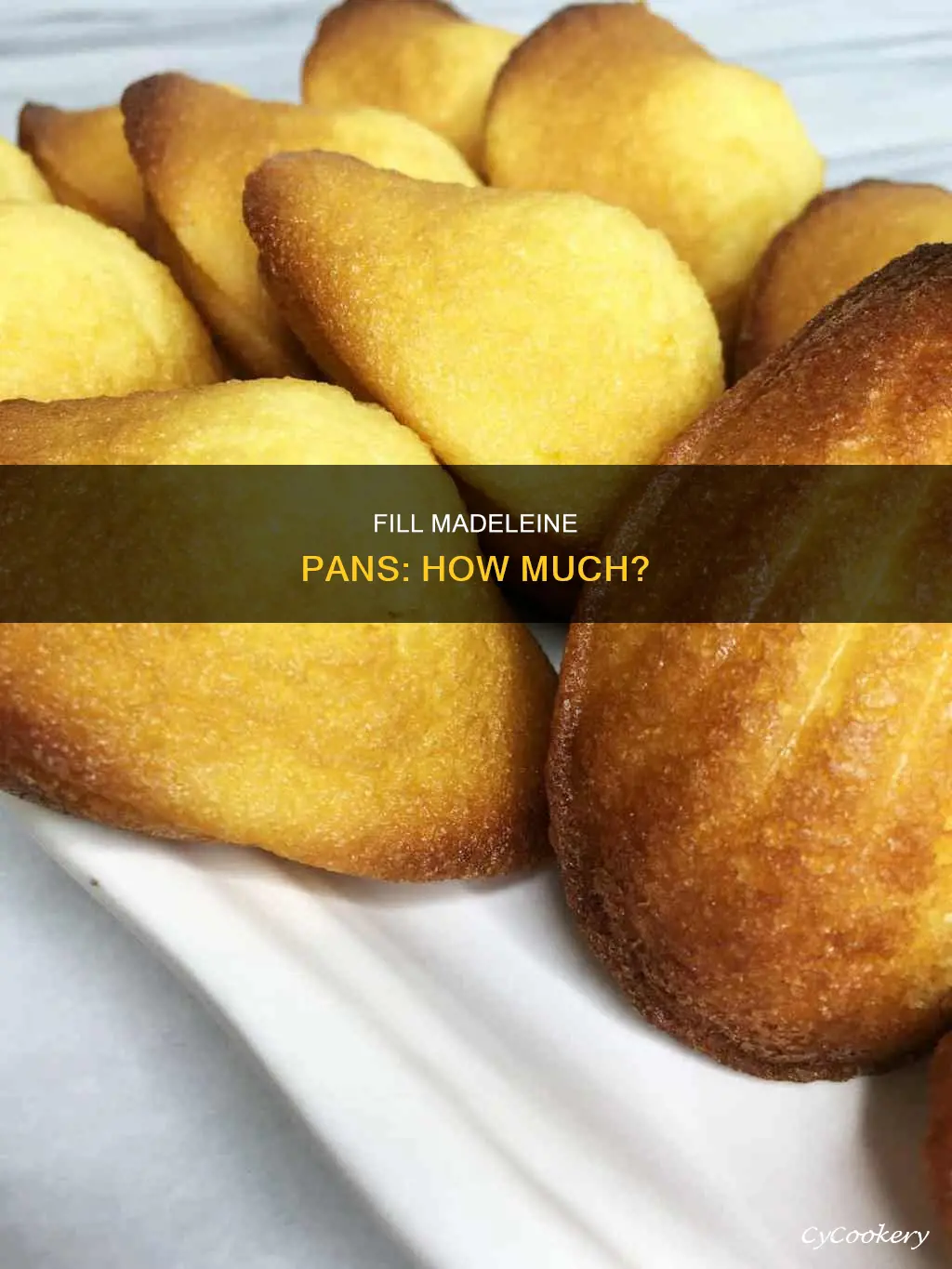 how much to fill madeleine pan