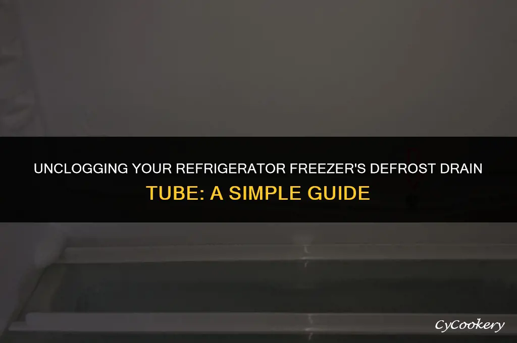 how to clear a refrigerator freezer defrost drain tube