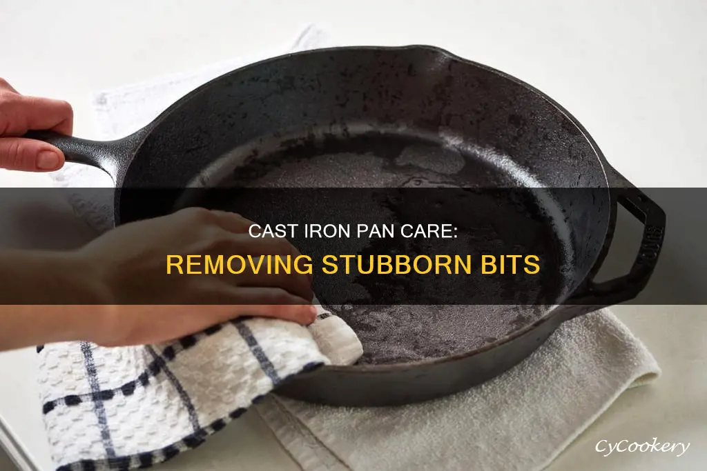 how to get stuck bits off cast iron pan