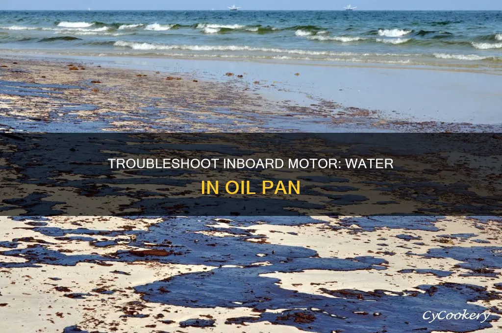 what causes water in oil pan of inboard motor