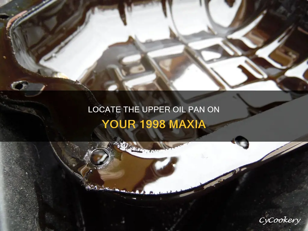 where is the upper oil pan 1998 maxia