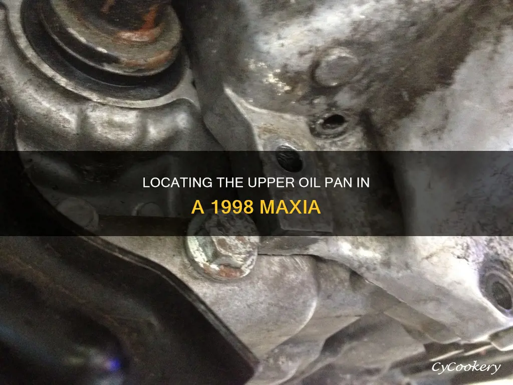 where is the upper oil pan 1998 maxia