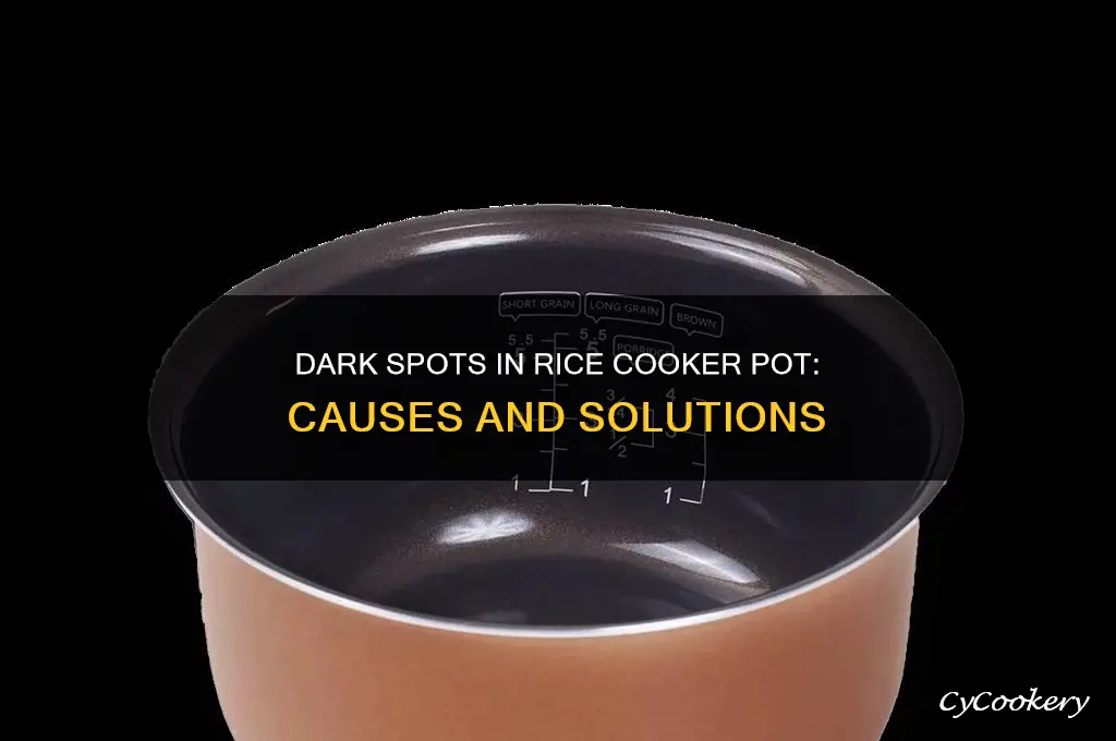 why does my rice cooker pot have dark sptos